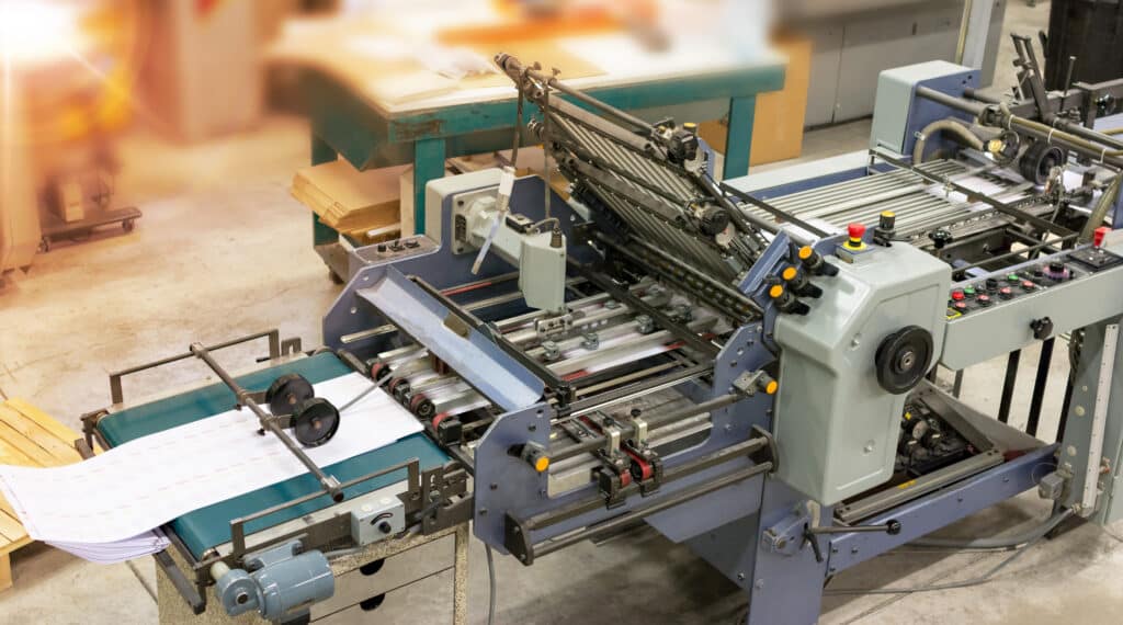 Folding documents for a mailing in a press